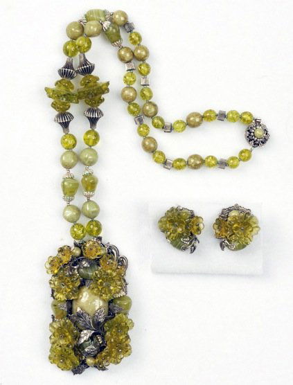 MIRIAM HASKELL NECKLACE and EARRING SET.: Green marbleized and art glass bead necklace having massive rectangular pendant of silver glass and beads on silvered filigree, with matching ear clips. Signed. Necklace 15 inches. Excellent.
