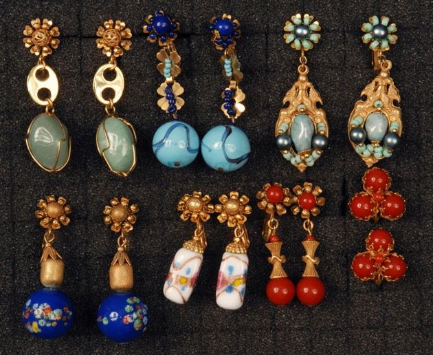 SEVEN PAIR MIRIAM HASKELL EARRINGS.: All gilt metal clip style, mostly drops, including art glass and carnelian beads. Signed. Largest 2 inches. Excellent.