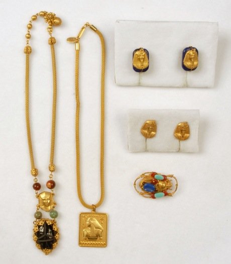LOT of MIRIAM HASKELL EGYPTIAN REVIVAL JEWELRY.: Consisting of two gilt mesh rope necklaces, one having square pendant with deity, one having black glass scarab pendant suspended from glass beads and pharaoh head, two pair pharaoh head earrings, one