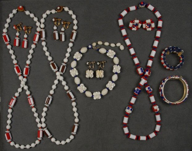 MIRIAM HASKELL PATRIOTIC DEMI PARURE.: Necklace, bracelet and ear clips with mosaic and plastic beads. Together with a similar bracelet and three plastic bead necklaces with matching earrings. Signed. Necklaces 8 1/2 - 15. (Minor mosaic lo