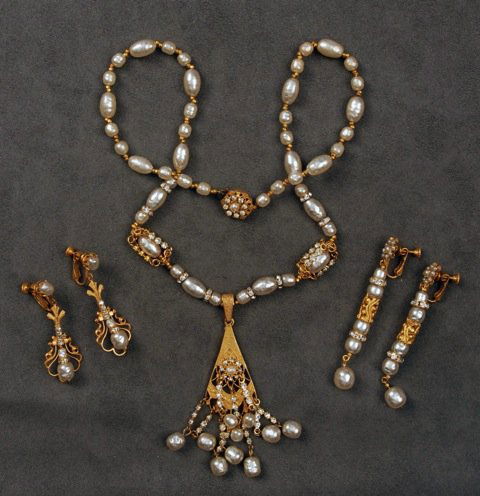 MIRIAM HASKELL PENDANT NECKLACE and TWO PAIR EARRINGS.: Pearl necklace with caged pearl and rhinestone separators having large tasseled pendant. Two pair non-conforming pearl earrings. Signed. Necklace 15 inches. Excellent.