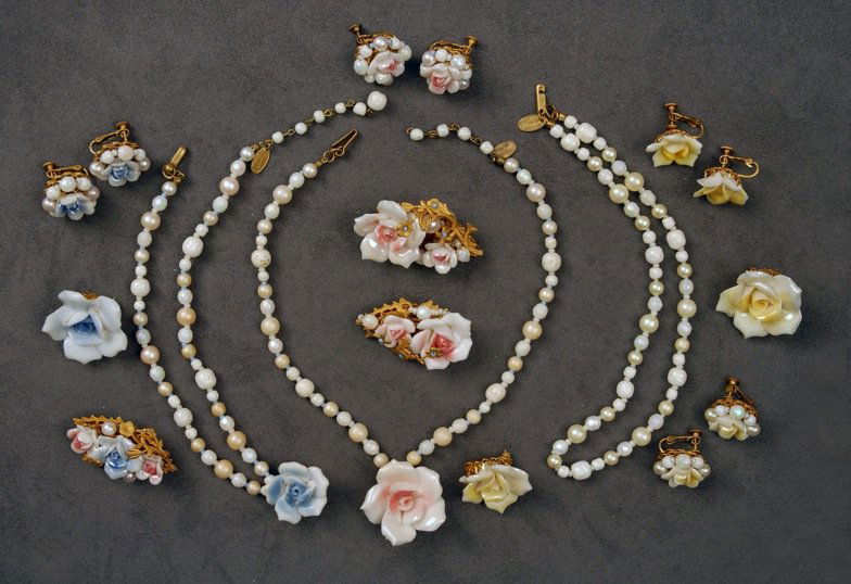 LARGE LOT of MIRIAM HASKELL ROSE FLOWER JEWELRY.: Flowers of porcelain or glass, six pins, three with gilt stampings and pearls, four pair ear clips and three pearlized bead necklaces, two having roses, thirteen pieces. Signed. Necklaces 8 inches, pi