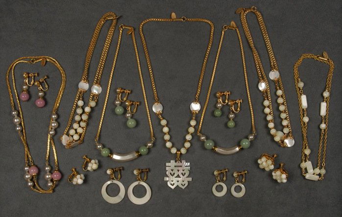 LOT of MIRIAM HASKELL MOTHER of PEARL and BEAD JEWELRY.: Seven necklaces having various shell and bead separators, one with carved pendant, all having matching or related earrings. Signed. Necklaces 7 - 15 inches. Good-excellent.