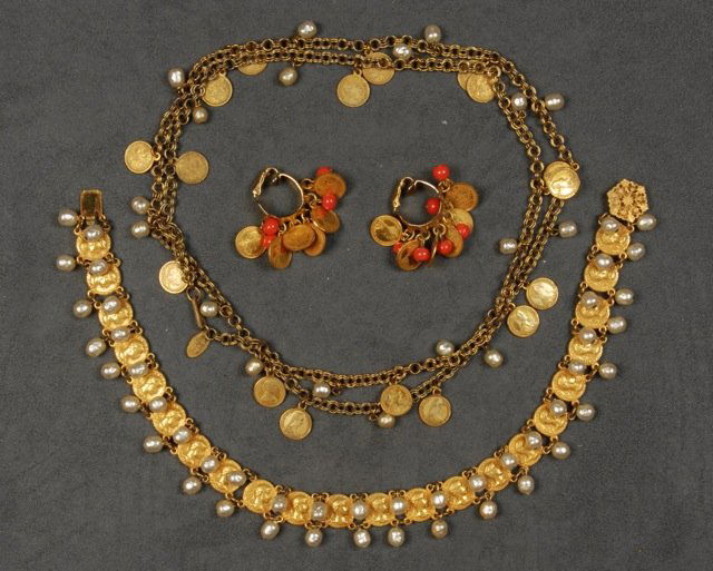 THREE PIECES MIRIAM HASKELL FAUX COIN JEWELRY.: One choker having joined coins and double row of pearls, one gilt chain with alternating pearl and coin drops, one pair of hoop earrings with coins and coral colored beads. Signed. Necklaces 13 and 18