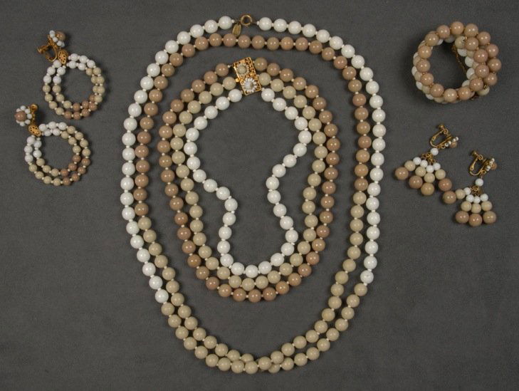MIRIAM HASKELL FIVE PIECE PARURE.: White, grey and taupe glass beads, three strand necklace, long necklace, cuff bracelet, drop and hoop earrings. Signed. (Some verdigris to cuff) good-excellent.