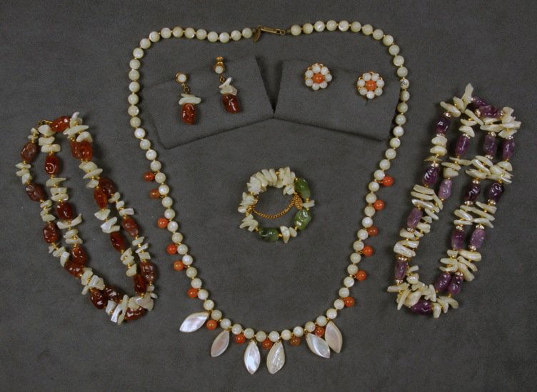 LOT of MIRIAM HASKELL SHELL JEWELRY.: Three necklaces, all having shell chips and colored beads, two with matching earrings, one similar memory wire bracelet. Signed. Necklaces 15 inches. Excellent.