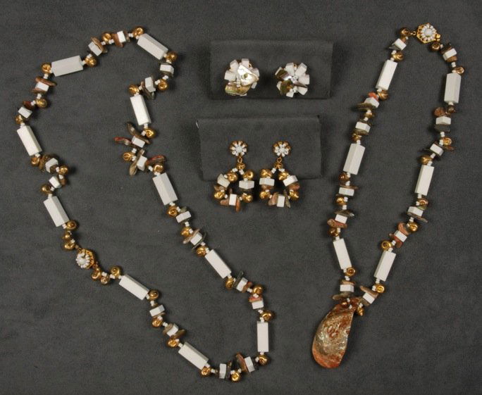 LOT of MIRIAM HASKELL SHELL JEWELRY.: All having white rectangular beads, gilt shells and shell chips, two necklaces, one having natural shell pendant, two pair matching ear clips. Signed. Necklaces 11 - 15 inches. Excellent.