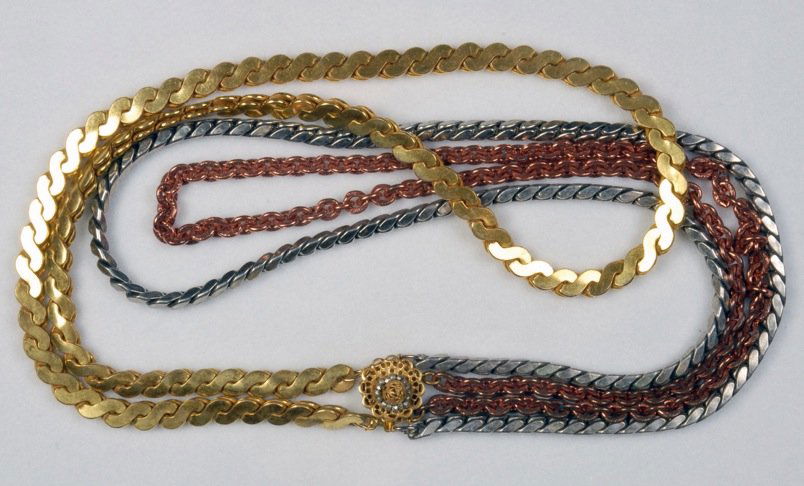 MIRIAM HASKELL THREE STRAND NECKLACE.: Heavy variform chains with gilt, silvered and copper finish. Signed. 14 1/2 inches. Excellent.
