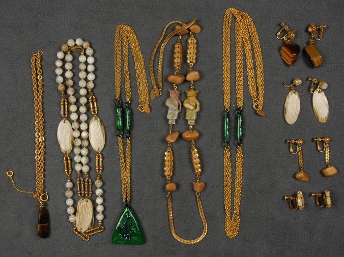 LOT of MIRIAM HASKELL JEWELRY.: Four necklaces with various glass and plastic spacers, one having pendant, three pair matching earr clips, link and faux tiger's eye bracelet with matching ear clips. Signed. Good-excellent.