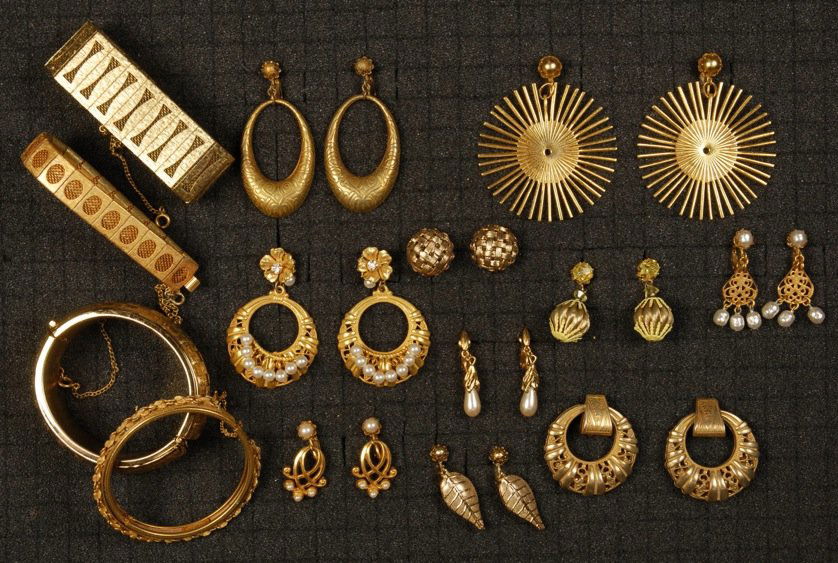 LOT of MIRIAM HASKELL GILT METAL JEWELRY.: Four hinged bracelets and ten pair ear clips, some with pearls. Signed. Good-excellent.
