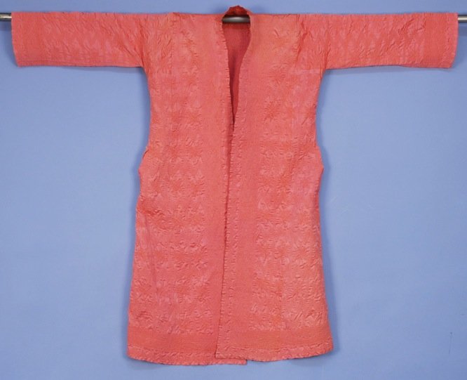 SYRIAN QUILTED ROBE, 20th C.: Pink silk lavishly quilted with stars, sawtooth and other geometric devices. 60 x 48. Pristine.