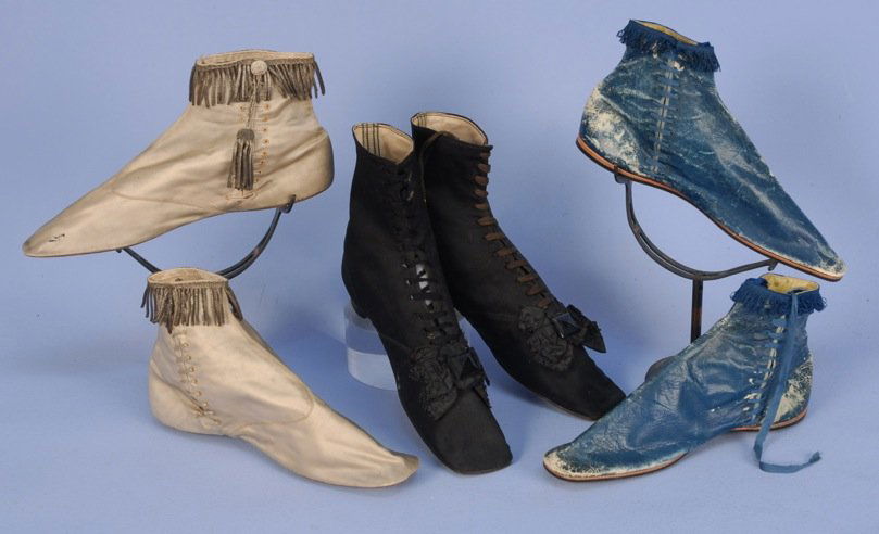 THREE PAIR LADIES' SHOES, 1830's - 1840's.: One pair black wool ankle height straights with low heel, front laces and vamp decorated with beaded silk bow having faceted jet ornament (minor wear). Two pair flat side lacing short boots: One ivory
