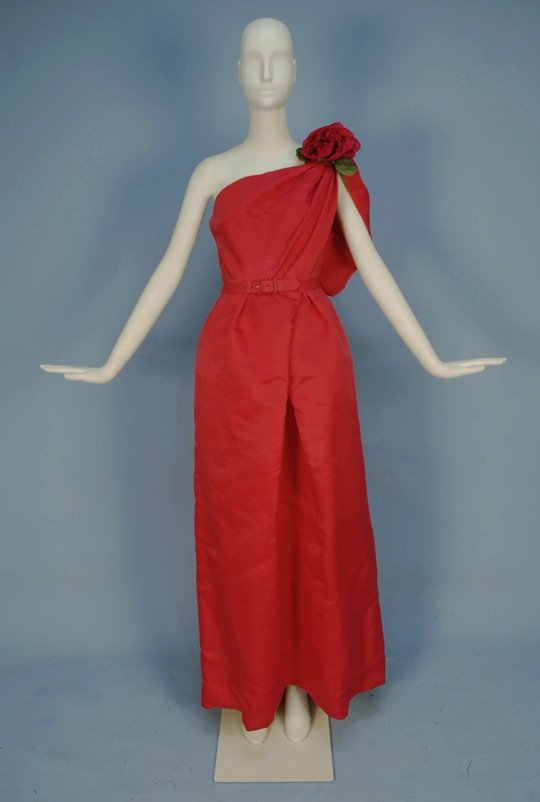 NINA RICCI DESIGN ONE-SHOULDER BALL GOWN, 1960's.: Hot pink silk with boned bodice gathered to one shoulder in soft pleats, set-in waist, front of skirt having crossed pleats over tulle and satin underskirts, side zipper, detachable train snapping ben