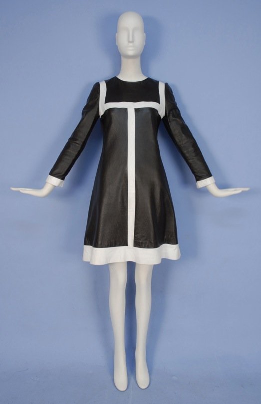 MOD LEATHER DRESS, 1960's.: Long sleeve deep brown A-line with jewel neck, trimmed with white leather bands, back zipper, satin lining. Label "Maxine Marlowe". B-34, L-37. Excellent.