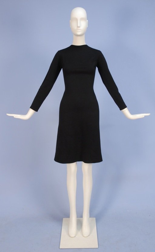 RUDI GERNREICH WOOL DAY DRESS, 1970's.: Long sleeve fitted black knit having jewel neck, topstitched darts and narrow low back. Harmon Knitwear label. Without stretching B-34, W-26, H-34, L-40, marked size 8. Excellent.