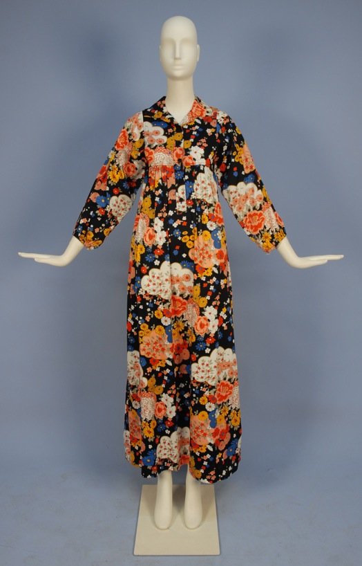 SAINT LAURENT RIVE GAUCHE PRINTED COTTON DAY DRESS, c.: Colorful floral on navy ground with gathered kimono cut 3/4 sleeve, collared yoke with button placket and long, gathered skirt. Labeled. Marked size 38. Excellent.