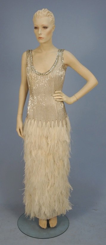 BEADED EVENING GOWN and JACKET with FEATHERS, 20th C.: Sleeveless scoop neck white gown decorated with vertical bands of silver bugle beads, neckline and armhole banded with beads and sequins, skirt covered in marabou feathers, matching long jacket with s