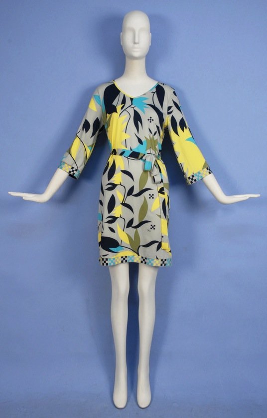 EMILIO PUCCI PRINTED SILK JERSEY DAY DRESS, 20th C.: Three quarter sleeve with signature "Emilio" abstract foliage print in olive, yellow, aqua and black on grey ground, checkered cuff and hem band, self belt. Labeled. Size 40. Excellent.