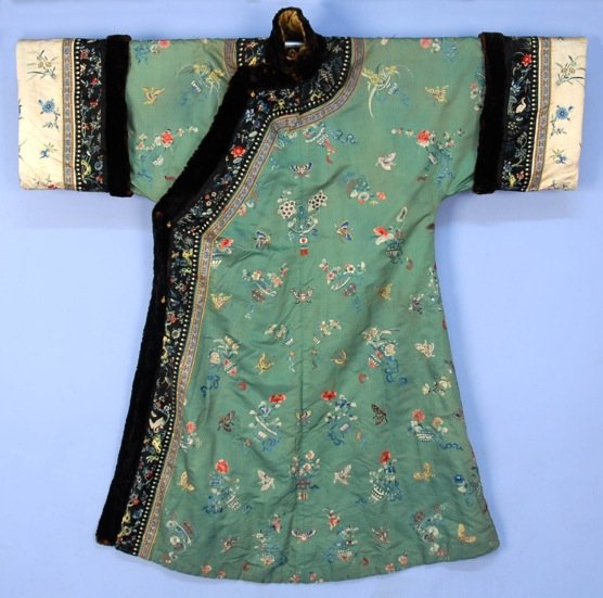 CHINESE SILK EMBROIDERED WINTER ROBE, EARLY 20th C.: Seafoam silk decorated with butterflies and floral urns, trimmed in embroidered black satin, brocade ribbon and beaver fur, ivory satin on sleeve, brass buttons, lined in black and white striped wool 