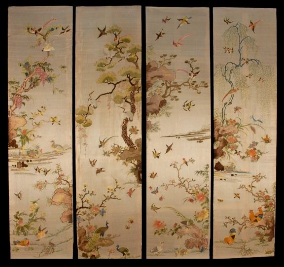 CHINESE EMBROIDERED SCREEN PANELS, 19th C.: Silk on silk panels each depicting a different tree on rockwork ledge, with exotic birds and insects. Sewn-not glued down-to wooden stretchers, backed in brocade silk. 40 x 10. (Slight abrasion at edg