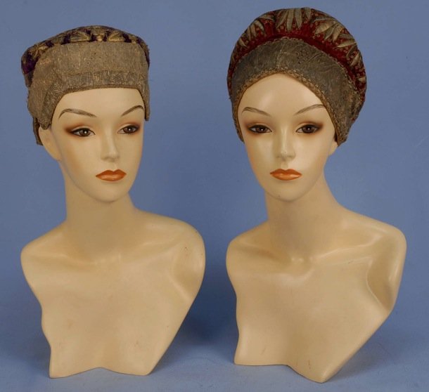 TWO RUSSIAN METALLIC EMBROIDERED HATS, 19th C.: Both having padded gold satin stitch floral and metallic trim band, one red, one purple. (Some wear to velvet, minor thread loss) good. MMA.