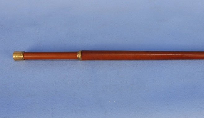 GENTLEMAN'S WALKING STICK. 19th C.: Long walking/hiking stick with gold cap and ring (untested), engraved "Gerard Walton". Length 51". Excellent.