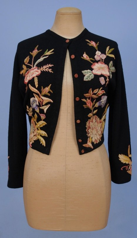HELEN BOND CARRUTHERS APPLIQUED CASHMERE CARDIGAN,: Black with applied satin stitch floral embroidery and silk lining. Labeled. B-38, W-25, L-18 1/2. Excellent.