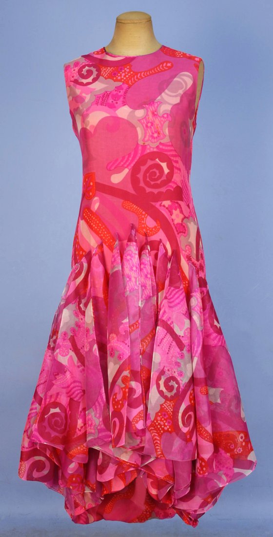 PIERRE CARDIN PSYCHEDELIC PRINTED DRESS and STOLE,: Sleeveless silk organdy in shades of pink having abstract print, skirt with hi-low hem and a series of applied triangular panels, silk crepe lining and matching stole. Labeled. B-38, W-35, H-40, L-44-