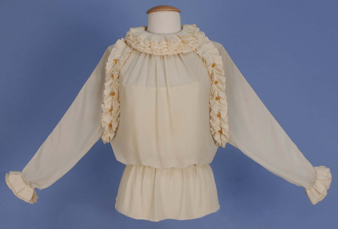 CHANEL SILK BLOUSE and CAMISOLE.: Cream crepe long sleeve blouse with seven pleated ruffles at neck, ruffled cuff and front raglan seam with gilt buttons, gathered waist with elastic, matching camisole with back zipper. Boutique label