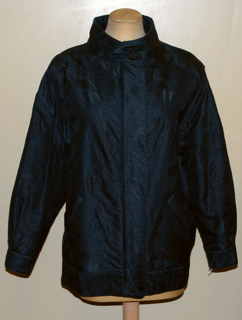 GEOFFREY BEENE ONE of a KIND COUTURE EVENING BLOUSON.: Alber Elbaz black paisley jacquard having banded collar, hem and front placket with two rose form buttons over hidden zipper, cuffed sleeve, angled pockets. Labeled. B-42, L-28. Excellent.