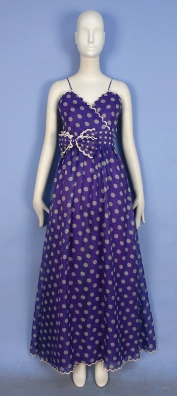 NINA RICCI PARIS DOTTED SILK GOWN.: Sleeveless lilac organdy with white dots, crossed sweetheart bodice with spaghetti strap, wide self belt with bow, white scalloped trim, silk under-skirt. Haute Boutique label. B-34, W-26, L-60. Excel