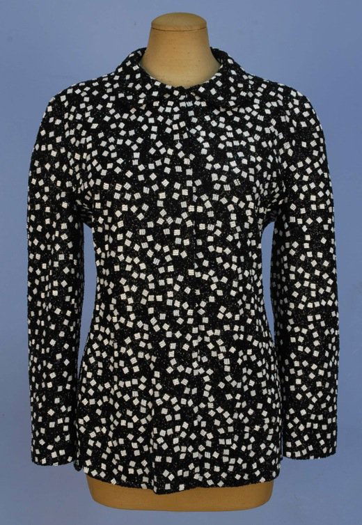 GIORGIO ARMANI BEADED EVENING JACKET.: Allover bugle beads in a pattern of random white squares on black ground, round collar, side slits, satin lining. Milan label. Marked size 42. Excellent.