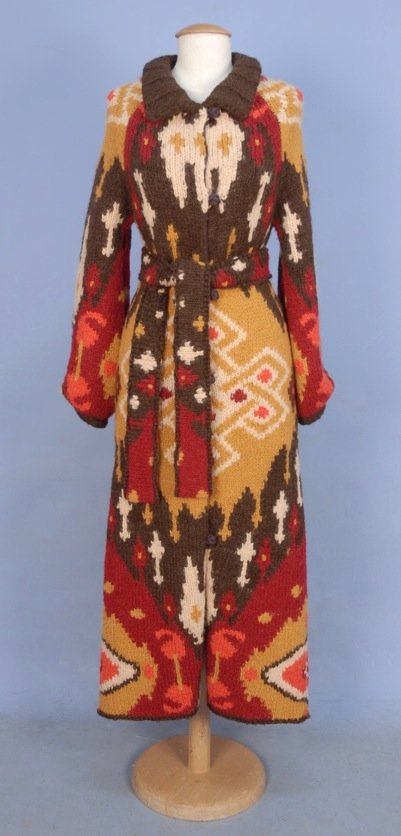 TWO LADIES' DESIGNER KNIT GARMENTS: One Versace white angora blend sleeveless funnel neck sweater, size 40. One Shanghai Tang ankle length angora sweater coat in an ikat style pattern with knotted buttons, self belt and printed silk lin