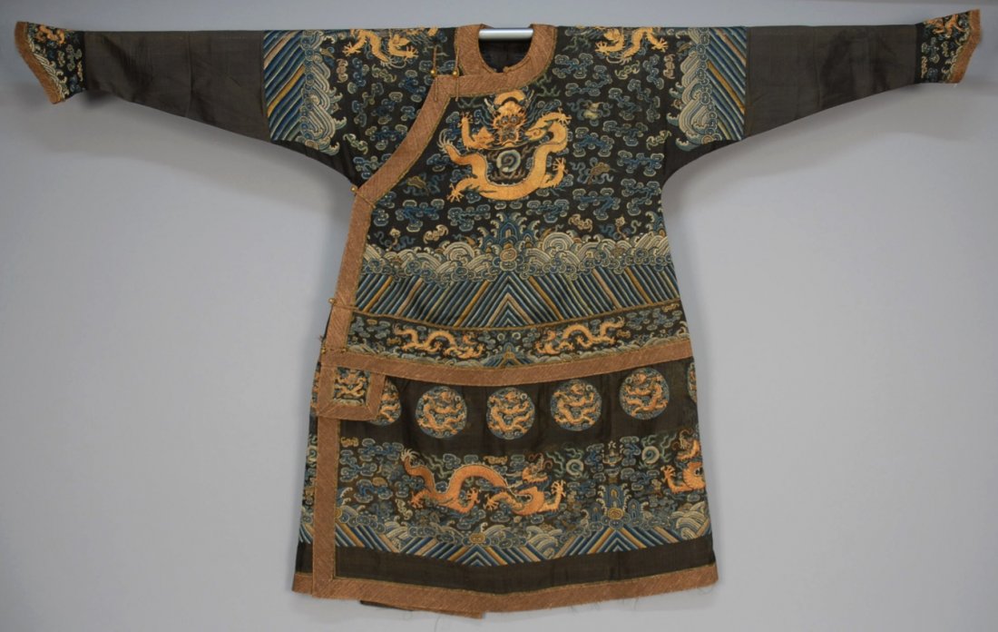 CHINESE FORMAL SUMMER COURT ROBE, LATE 18th - EARLY: Black gauze Chao Pao embroidered with silk and couched gold, overall there are 30 dragons: Two front facing on front and back, tone on each shoulder and cuff, four across the waist, fourteen roundels 