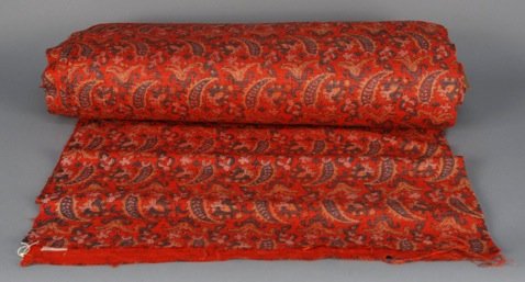 LARGE QUANTITY of INDIAN PRINTED SILK YARDAGE, EARLY: Printed raw red silk with vertical paisley design upon a field of floral sprigs. Approximately 19 1/2 yards x 52 inches. Excellent. FIT.