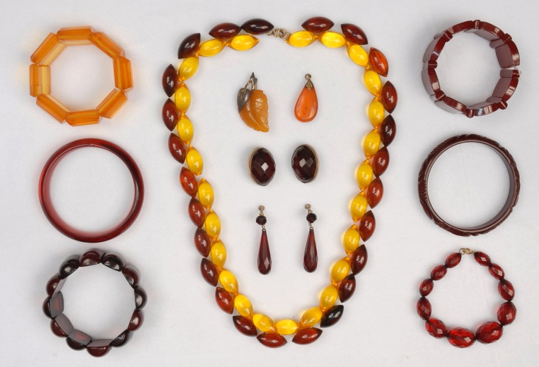 LOT of AMBER BAKELITE, MID 20th C.: Including bead necklace, six bracelets, two pins and two pair earrings. (11). Excellent.