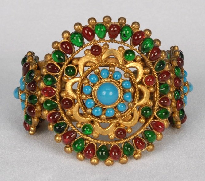 CHANEL GRIPOIX JEWELED MUGHAL INSPIRED CUFF BRACELET,: Heavy goldtone base having large openwork medallion flanked by two smaller medallions, all set with emerald, ruby and turquoise Gripoix stones. Marked Chanel and dated 1993. Center medallion 3 x 2 5/8