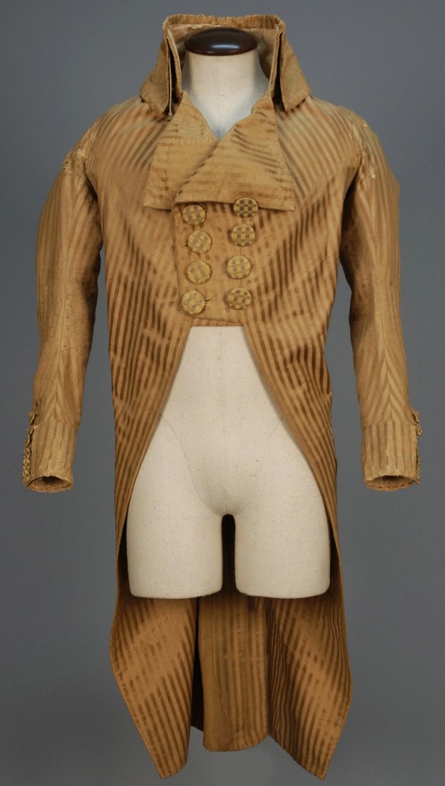 GENTS AMERICAN STRIPED SILK COAT, 1792 - 1799.: Double breasted tan coat with satin stripe having boned wide fold-down collar, deep cuff with elongated button placket, V-shaped pocket with scalloped flap, pleated back with scalloped vent and two-to