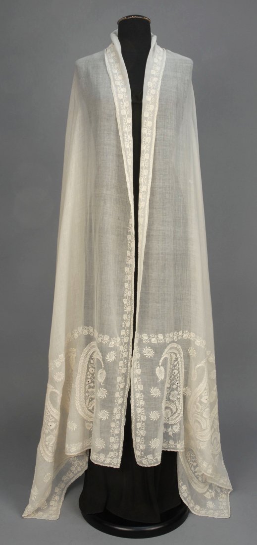 WHITEWORK EMBROIDERED COTTON SHAWL, EARLY 19th C.: Long muslin rectangle, probably Bengali, having a serpentine border of vining strawberries in broderie Anglaise, and deep end borders with large elaborate botehs. 35 x 110. (1 1/2 inch tear near one e