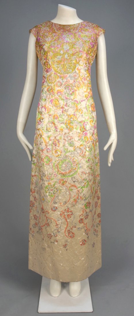MARC BOHAN for CHRISTIAN DIOR CHINE SILK EVENING DRESS,: Sleeveless with notched armhole having princess seams and narrow skirt with polychrome warp print and metallic brocade floral in silver and gold, silk gazar lining. New York Label. B-38, W-34, H-41, L