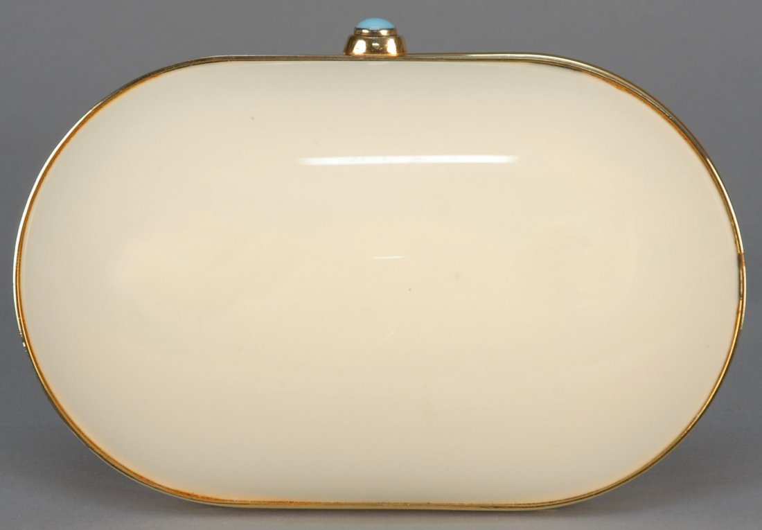 JUDITH LEIBER CAPSULE CLUTCH.: French vanilla resin with hinged brass frame, robin's egg blue cabochon plunger clasp, gold leather interior and coin purse, optional hinged chain handle and silk tassel. 7 x 4 1/2. Excellent.