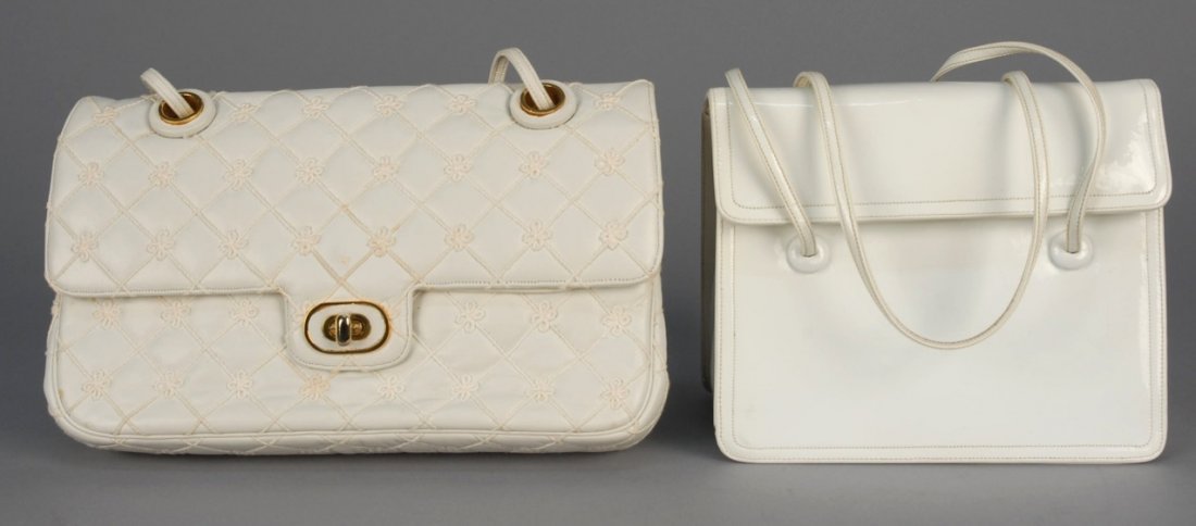 TWO JUDITH LEIBER LEATHER HANDBAGS.: Both twin handled: One cream quilted with cording and bow pattern, three compartments and change purse, brass label. 9 1/4 x 5 1/2 x 2 with 11 inch handle, (few tiny spots) very good. One white patent