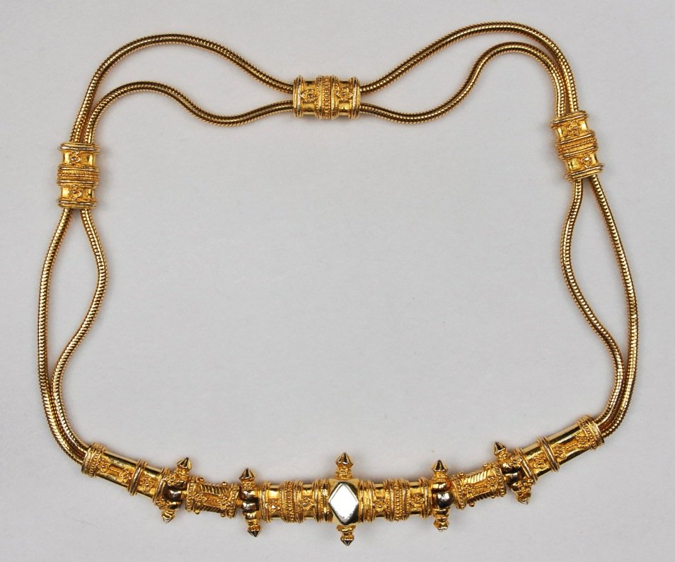 JUDITH LEIBER DOUBLE GOLD ROPE BELT.: Twin cables having ornate spacers and hinged buckle. Labeled. L-29. Excellent.