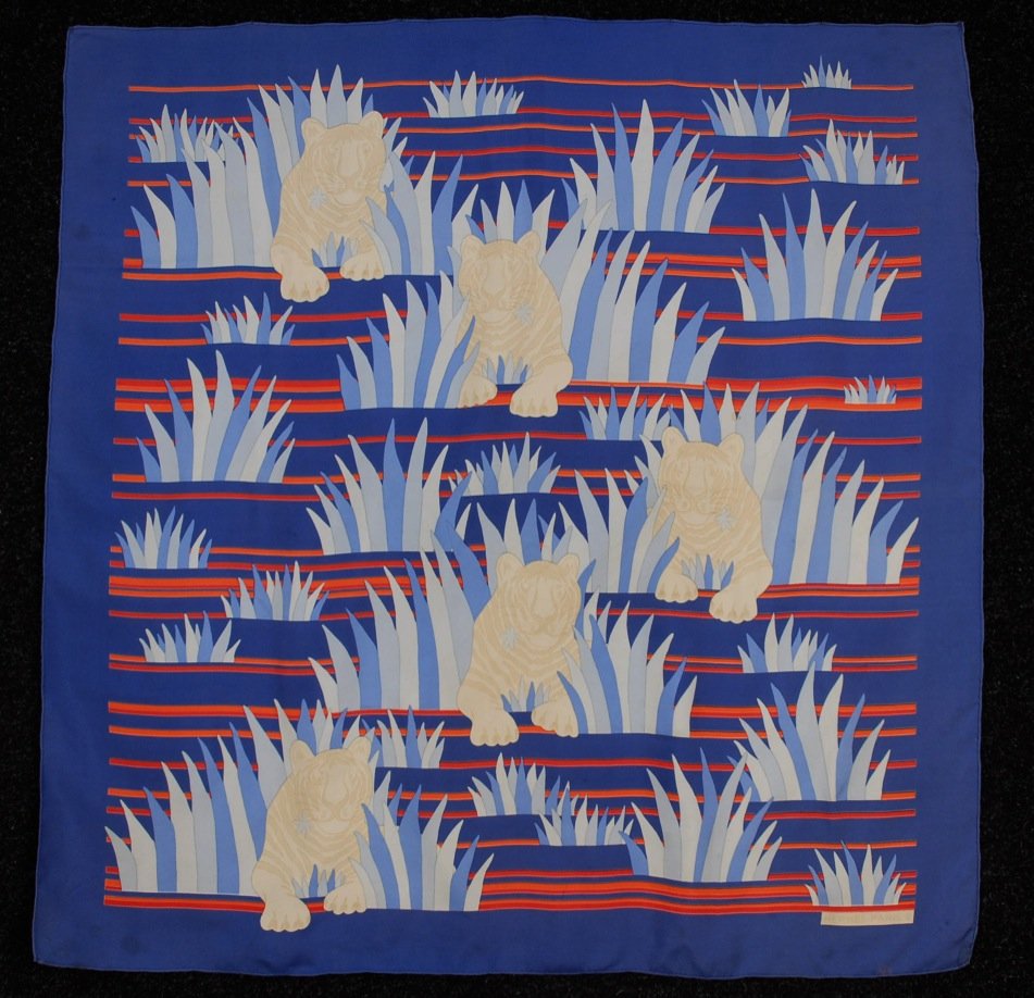 HERMES, PARIS TIGRES DANS les HERBES SILK SCARF,: Blue twill with white tigers amid grasses. Artist Joachim Metz. Labeled within design. 34 x 35. (Several spots and fade mark on border) good.