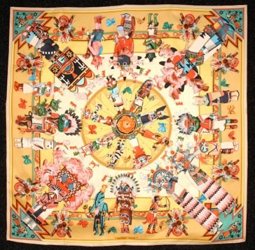 HERMES PARIS KATCHINAS PRINTED SILK SCARF, ISSUED 1992.: Costumed figures and Native American symbols on cream and gold ground by Kermit Oliver. Signed and marked "Hermes Paris". 35 1/2 x 35 1/2. Excellent.