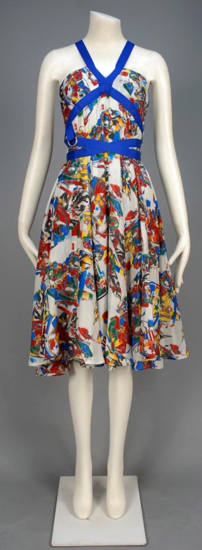 DEADSTOCK ALEXANDER McQUEEN PRINTED SILK SUMMER DRESS.: White with abstract floral print in primary hues having empire bodice with grosgrain ribbon straps crossing open back, circle skirt. Labeled, hang tags attached. B-34, high W-26 L-42. Excellent.