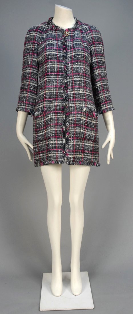 CHANEL PLAID SPRING COAT.: Cotton/rayon/wool blend in black, white and fuchsia plaid with metallic silver threads, raglan sleeve, classic fringed trim, patch pockets, single self button having gold collar and applied logo, blac