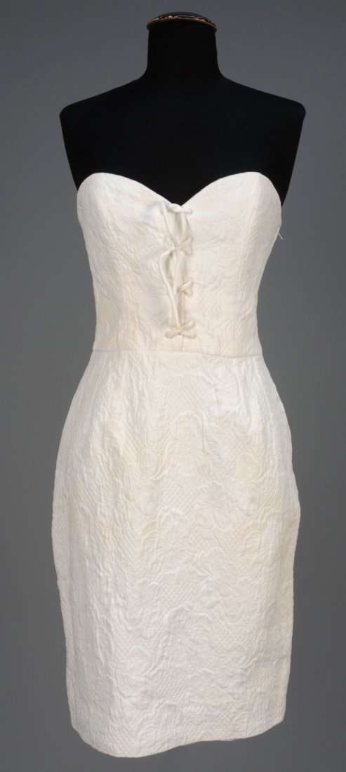 LANVIN PARIS STRAPLESS TRAPUNTO FRONT LACING DRESS.: White cotton in a pattern of violas, boned sweetheart bodice having faux self laces and pencil skirt. Labeled. B-34, W-26, H-36, L-31 1/2. (Bodice slightly soiled, needs cleaning) otherwise excellent.