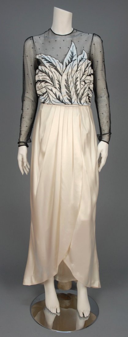 PAUL-LOUIS ORRIER BEADED NET and SATIN EVENING DRESS.: Long sleeve black dotted net bodice studded with beads having white silk charmeuse leaf appliques embroidered and beaded in black, silk wrap front tulip skirt, weighted hem, satin underskirt. Labeled.