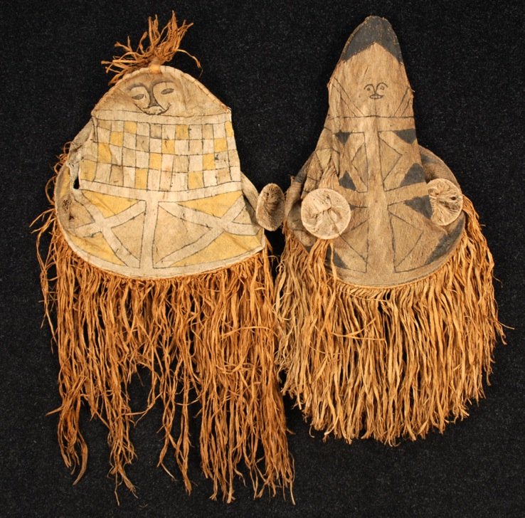 TWO AMAZON DANCE COSTUMES, MODERN: Cubeo/Kobeua peoples, Colombian Amazon, paint decorated natural fibers. 18 x 24 with 24 inch fringe. (Some holes and fringe losses, one ear detached) good.